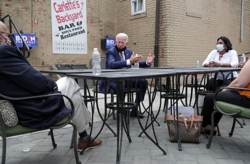 Democratic U.S. presidential candidate and former Vice President Biden sits and talks with local business owners during a campaign stop at a restaurant in Yeadon, Pennsylvania