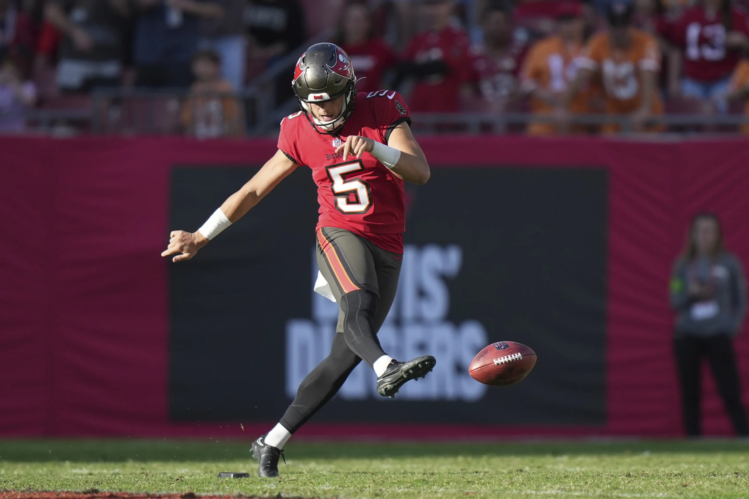 Tampa Bay Buccaneers punter Jake Camarda (5) tries an onside kick during an NFL football game against the New Orleans Saints, Sunday, Dec. 31, 2023, in Tampa, Fla. (AP Photo/Peter Joneleit)