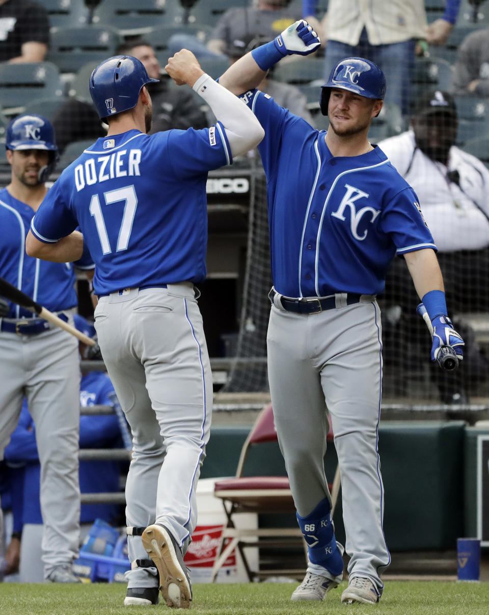 Kansas City Royals' Hunter Dozier, left, celebrates with Ryan O'Hearn after hitting a solo home run against the Chicago White Sox during the 10th inning of a baseball game in Chicago, Wednesday, April 17, 2019. The Royals won 4-3. (AP Photo/Nam Y. Huh)