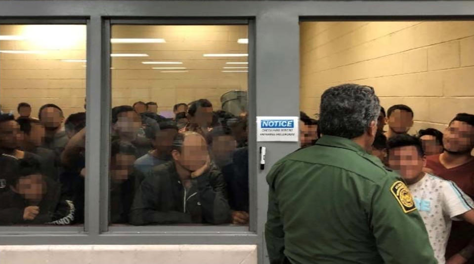 Men are crowded in a room at a Border Patrol station in a still image from video in McAllen, Texas, U.S. on June 10, 2019 and released as part of a report by the Department of Homeland Security's Office of Inspector General on July 2, 2019. Picture pixelated at source. (Photo: Office of Inspector General/DHS/Handout via Reuters)