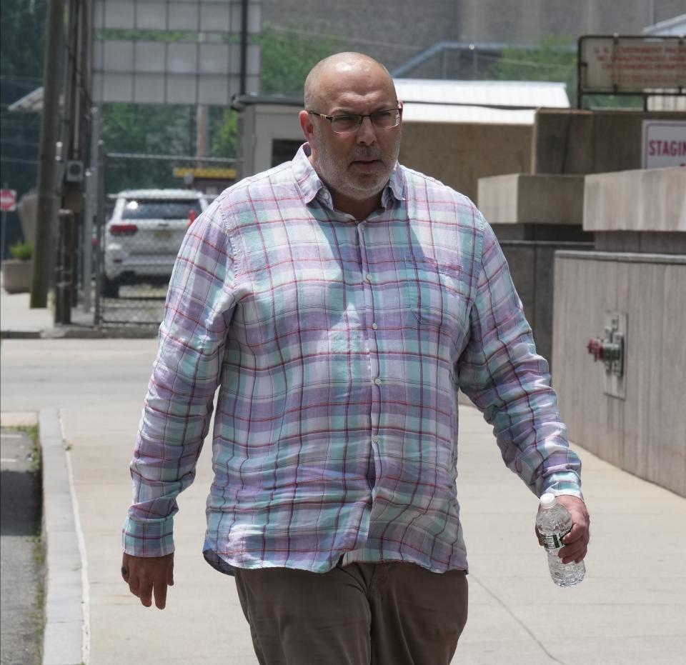 Sean Caddle walking to the Federal Courthouse in Newark where was sentenced.