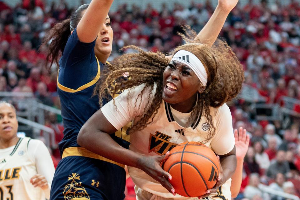 Louisville Cardinals forward Olivia Cochran (44) attempts a layup during their game against the Notre Dame Fighting Irish on Thursday, Feb. 8, 2024 at KFC YUM Center.