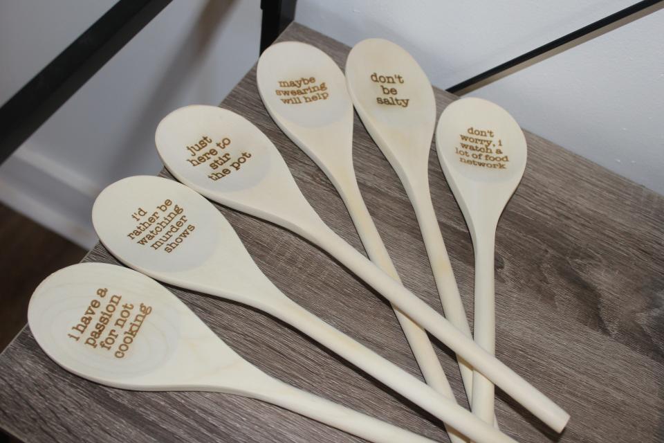 Other merchandise found at The Crunchy Pickle includes spoons with witty phrases on Friday, Feb. 3, 2023.