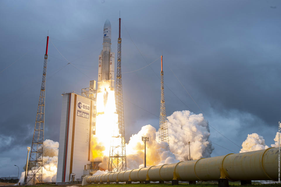 Arianespace's Ariane 5 rocket with NASA's James Webb Space Telescope onboard, lifts off Saturday, Dec. 25, 2021, at Europe's Spaceport, the Guiana Space Center in Kourou, French Guiana. The world's largest and most powerful space telescope has blasted off on a high-stakes quest to behold light from the first stars and galaxies. NASA's James Webb Space Telescope rocketed away Saturday from French Guiana in South America. (ESA-CNES-ARIANESPACE via AP)