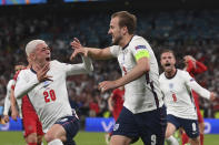 FILE - In this July 7, 2021 file photo England's Harry Kane, right, celebrates scoring his side's second goal during the Euro 2020 soccer semifinal match between England and Denmark at Wembley stadium in London. (Laurence Griffiths/Pool Photo via AP, File)