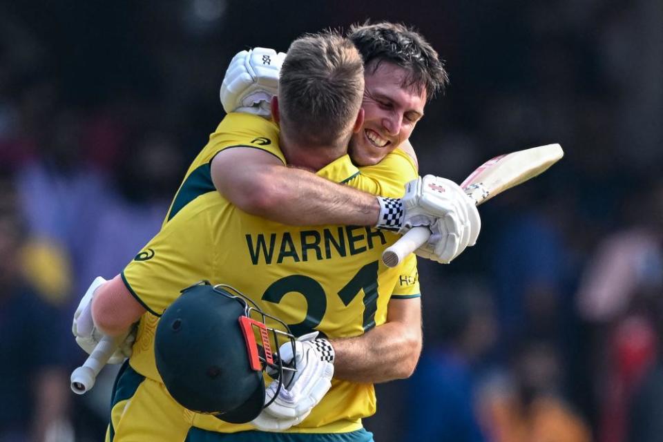 Mitchell Marsh gets a hug from David Warner after reaching his century against Pakistan.