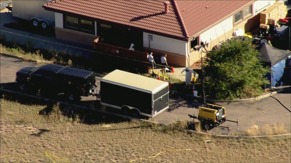   Investigators at the scene of Return to Nature Funeral Home in Penrose. / Credit: CBS