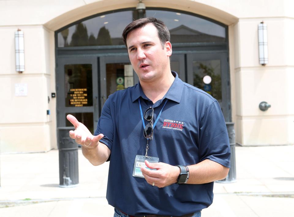 Putnam County Executive Kevin Byrne talks about the former car dealership on Gleneida Avenue in Carmel in front of the new Putnam County Courthouse which has been vacant for years July 19, 2024.