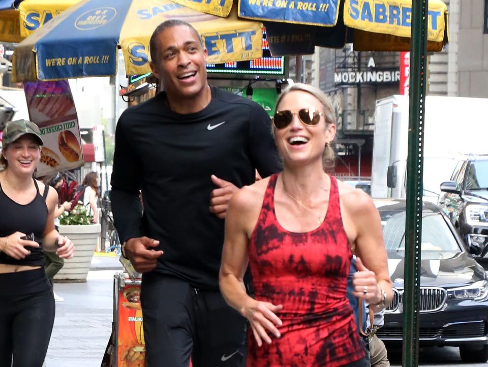 TJ Holmes and Amy Robach running in New York City in 2021.