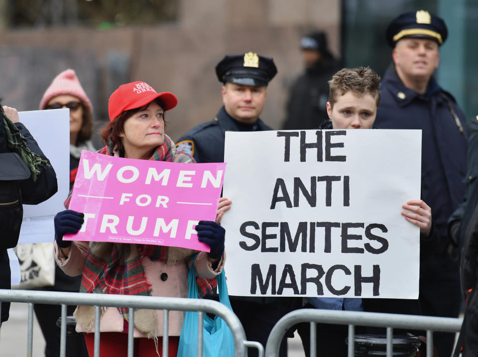 Counter-protesters hold signs as people march during the Women’s Unity Rally at Foley Square on Jan. 19, 2019 in New York City. (Photo: Angela Weiss /AFP/Getty Images)