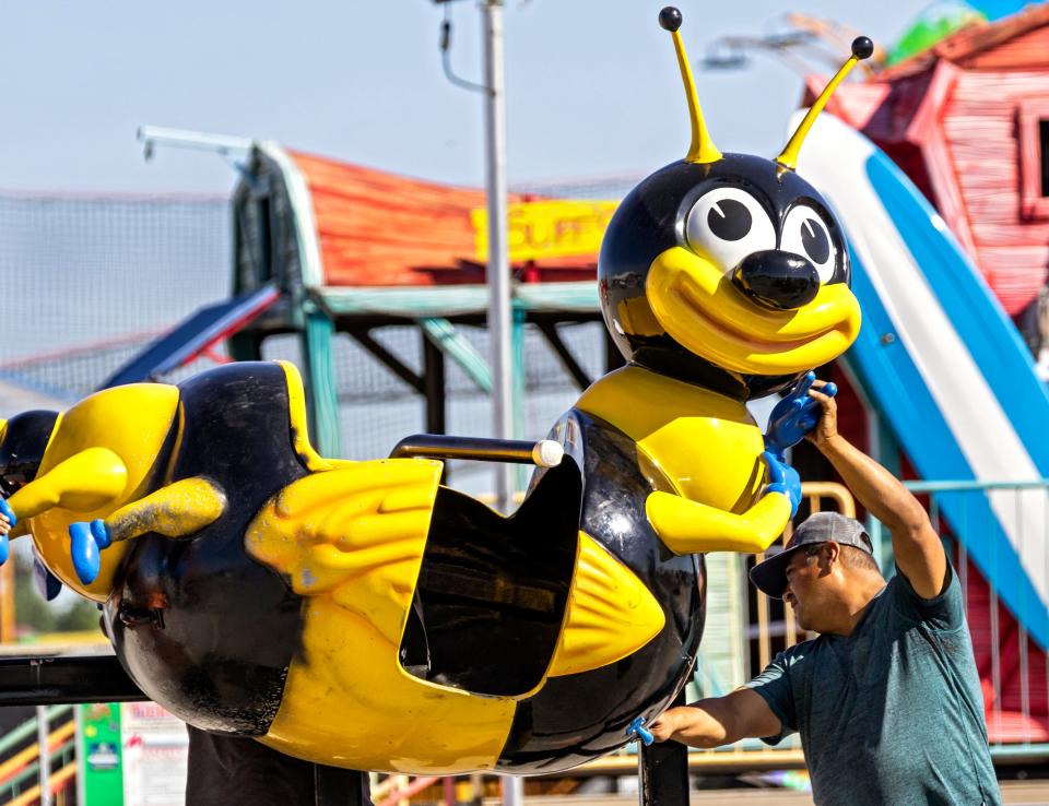 A bumble bee car gets attention on Monday, Sept. 12, 2022, as crews work to set up rides and attractions for the Oklahoma State Fair at the OKC Fairgrounds. The official opening of this year’s fair is on Thursday.