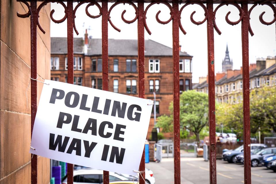 The posters were displayed at a polling station in Glasgow (PA) (PA Wire)