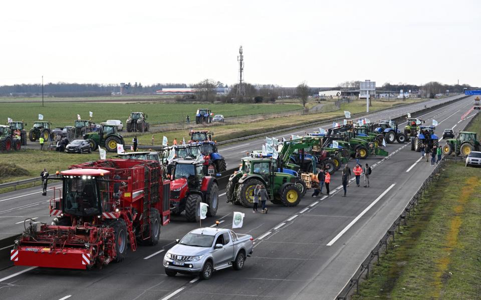 French farmers start a road block on the A4 highway near Jossigny, east of Paris, Jan 29