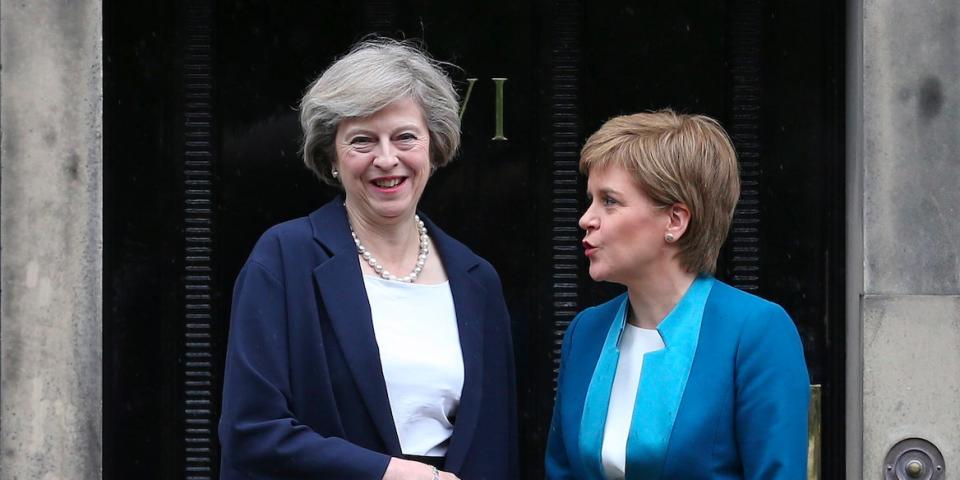 Scotland's First Minister, Nicola Sturgeon (R), greets Britain's new Prime Minister, Theresa May, as she arrives at Bute House in Edinburgh, Scotland, Britain July 15, 2016. REUTERS/Russell Cheyne