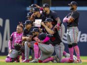 The Minnesota Twins pose for a Mother's Day photo after defeating the Toronto Blue Jays in a baseball game in Toronto, Sunday, May 12, 2024. (Frank Gunn/The Canadian Press via AP