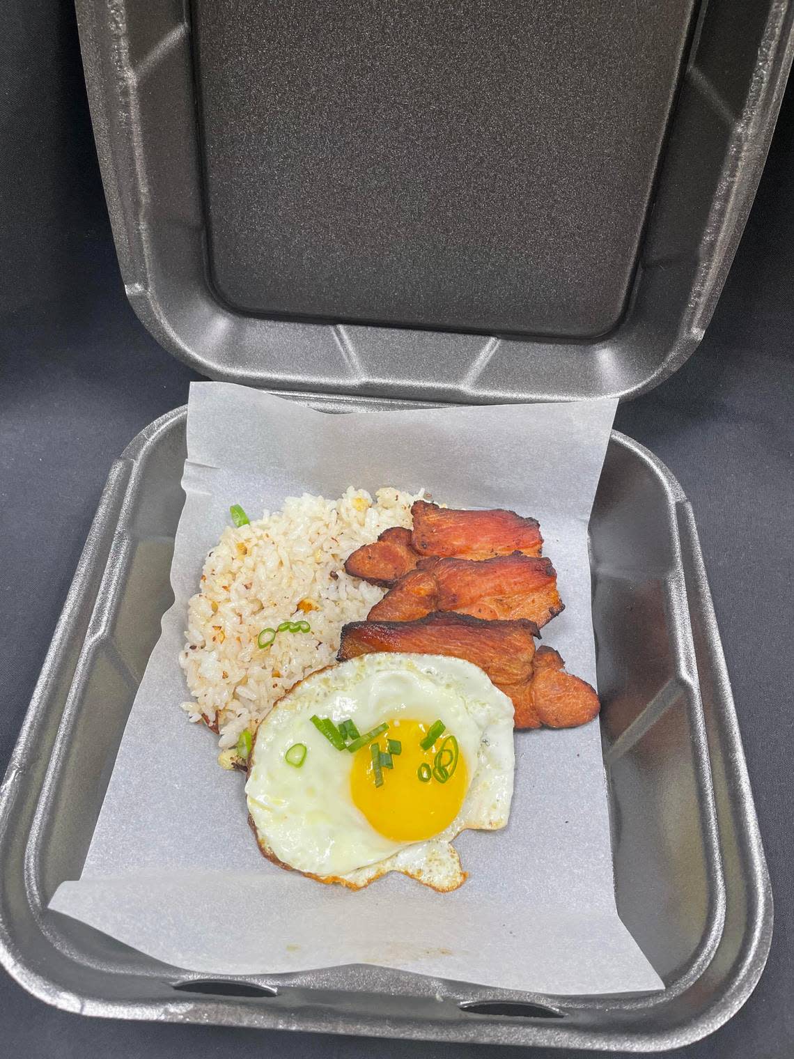 Filipino breakfast bowl with garlic fried rice, pork belly and an egg from the Root 76 Cuisine commissary opening soon in Warner Robins. This option is available with a brisket also.