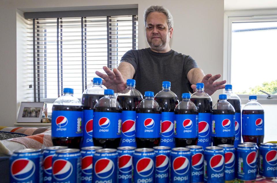 Pepsi addict Andrew Currie at his home in Bangor, North Wales. (swns)