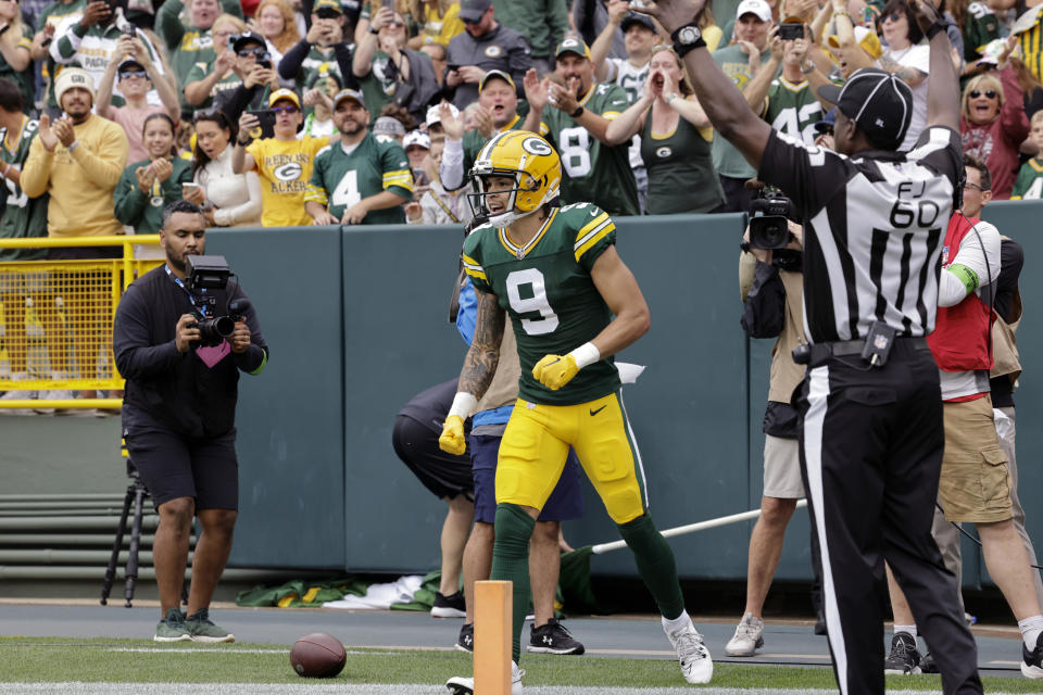 Green Bay Packers wide receiver Christian Watson (9) celebrates after catching a 6-yard touchdown pass in the first half of a preseason NFL football game against the Seattle Seahawks, Saturday, Aug. 26, 2023, in Green Bay, Wis. (AP Photo/Mike Roemer)
