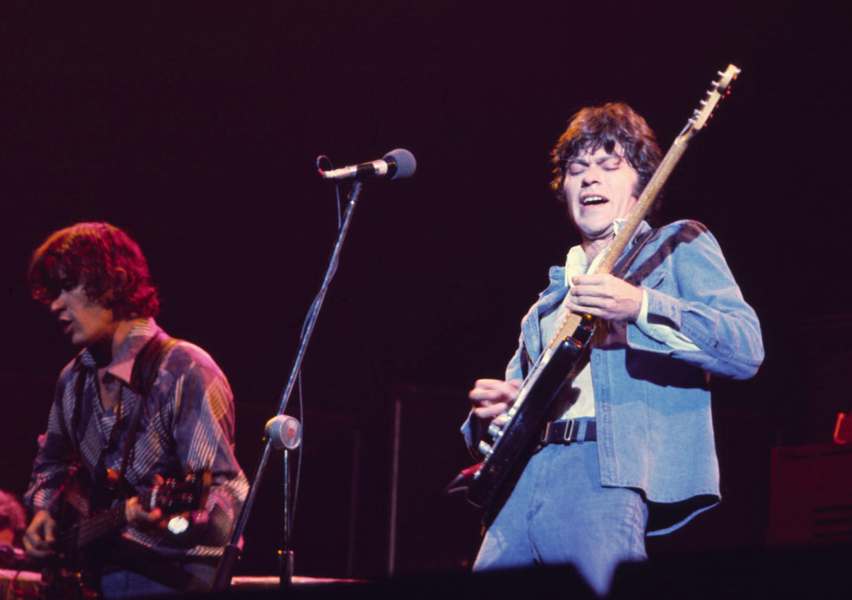 Rick Danko, left, and Robbie Robertson perform with The Band in 1976. (Richard E. Aaron / Redferns)
