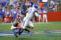 Kentucky running back Asim Rose Jr., right, tries to leap over Florida defensive back Shawn Davis (6) during the first half of an NCAA college football game, Saturday, Nov. 28, 2020, in Gainesville, Fla. (AP Photo/John Raoux)