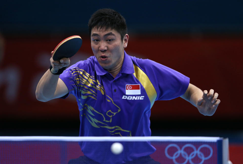 LONDON, ENGLAND - JULY 30: Ning Gao of Singapore returns the ball during his Men's Singles Table Tennis fourth round match against Wang Hao of China on Day 3 of the London 2012 Olympic Games at ExCeL on July 30, 2012 in London, England. (Photo by Feng Li/Getty Images)