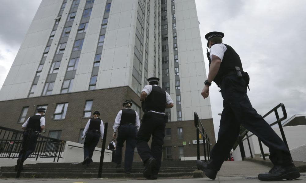 Police officers at Dorney Tower in Camden, London, after the building was evacuated due to fire safety concerns, June 2017