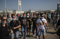 Nissan workers gather during a protest in Barcelona, Spain, Thursday, May 28, 2020. Japanese carmaker Nissan Motor Co. has decided to close its manufacturing plans in the northeastern Catalonia region, resulting in the loss of some 3,000 direct jobs. (AP Photo/Emilio Morenatti)