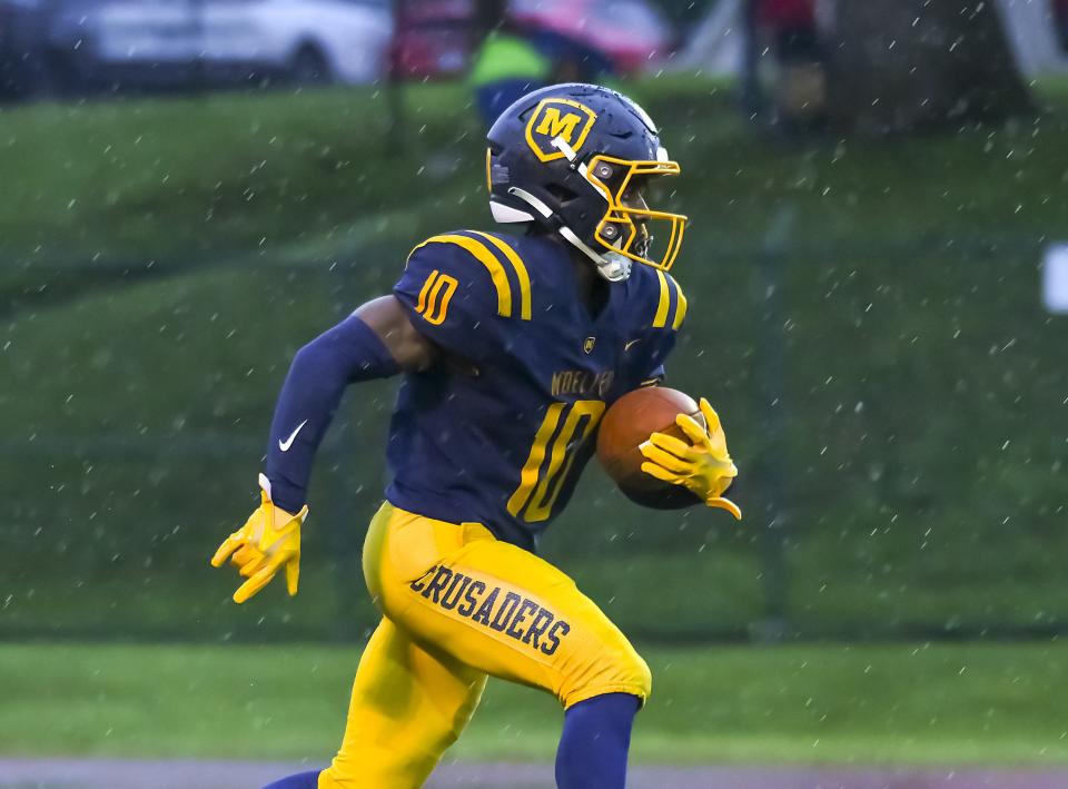 Tennel Bryant of Moeller runs the ball against East Central at Shea Stadium on Saturday, Sept. 3, 2022.