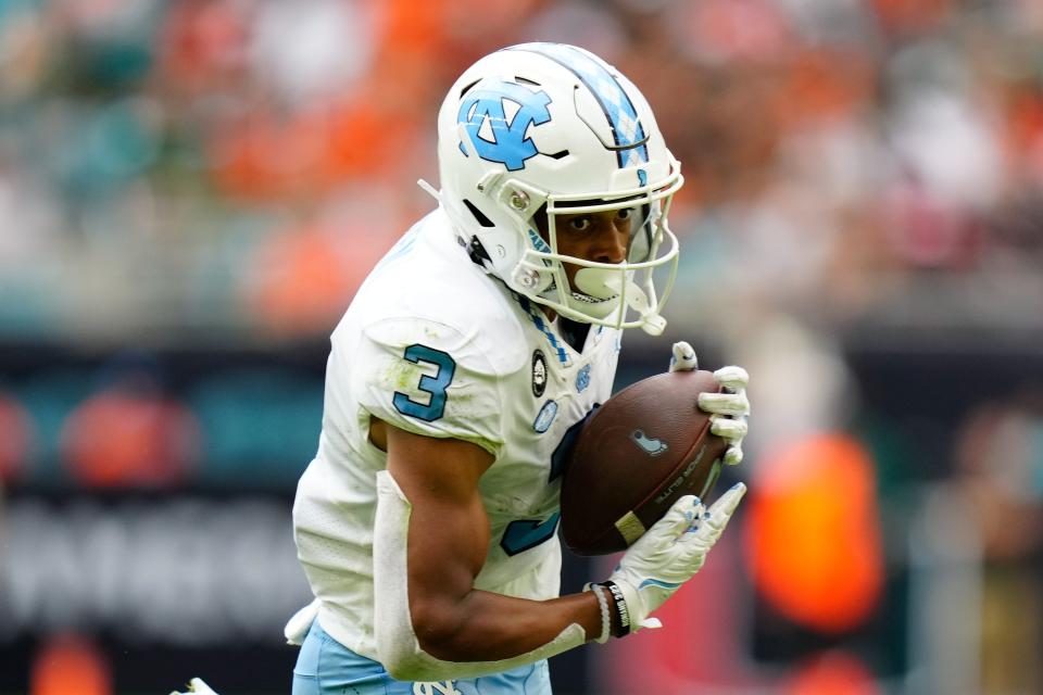 Oct 8, 2022; Miami Gardens, Florida, North Carolina Tar Heels wide receiver Antoine Green (3) runs the ball against the North Carolina Tar Heels during the first half at Hard Rock Stadium. Mandatory Credit: Rich Storry-USA TODAY Sports