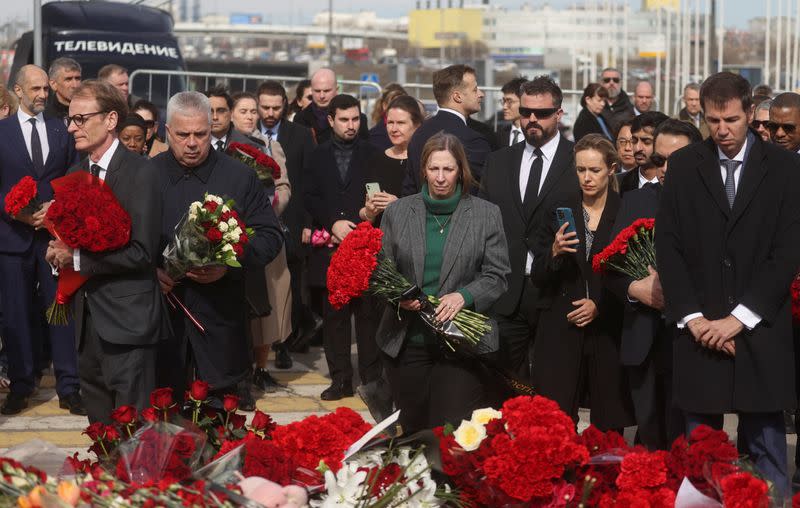 Ambassadors of foreign diplomatic missions lay flowers at the memorial for the victims of the attack at Crocus City Hall
