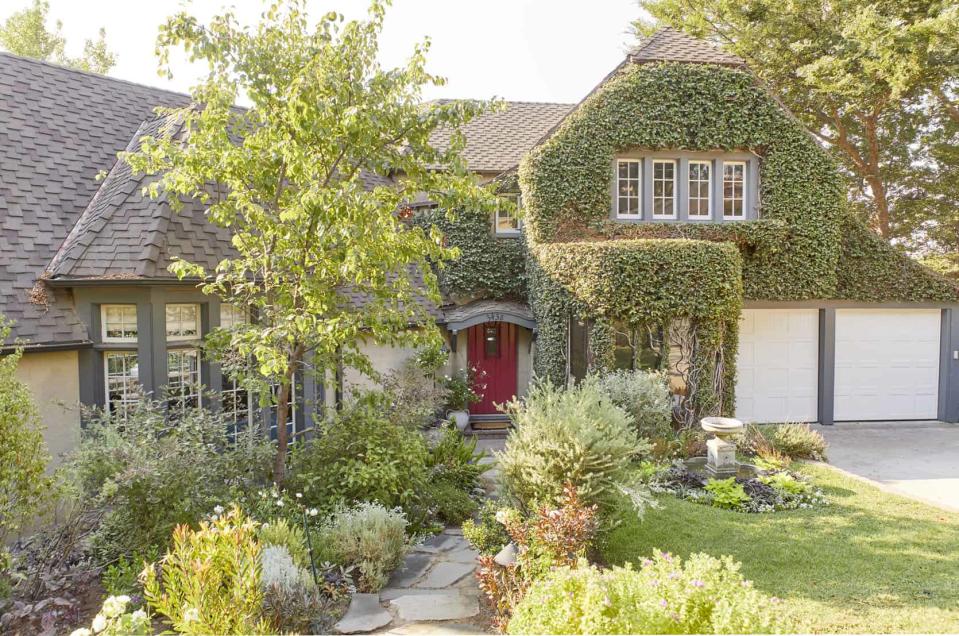 <p> Anyone who is seeking lush grounds with a touch of whimsy will fall in love with this front yard, courtesy of Emily Henderson. Here, the designer teamed up with Pete Hieatt of Deluxe Plants to create an American take on the traditional English countryside.  </p> <p> The duo paired the mélange of leafy greens with a stone walkway, water fountain, and tomato red front door. All of the front yard landscaping ideas used were designed to lead – and invite – the eye up to the front door, enhancing the home's front door to make it into a standout feature. </p>