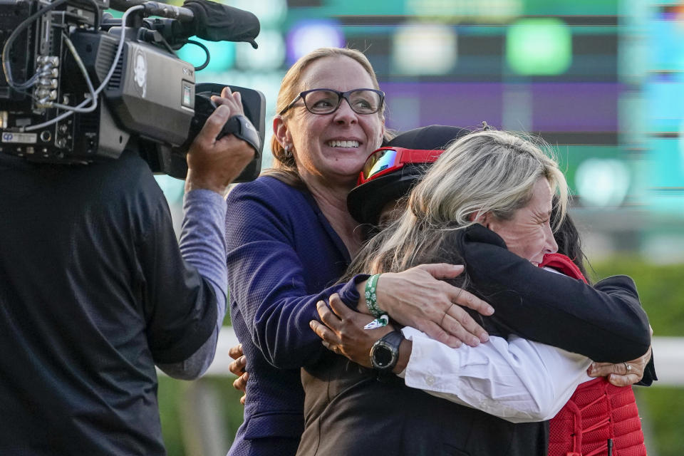 Trainer Jena Antonucci, left, celebrates after her horse Arcangelo won the 155th running of the Belmont Stakes horse race, Saturday, June 10, 2023, at Belmont Park in Elmont, N.Y. (AP Photo/John Minchillo)
