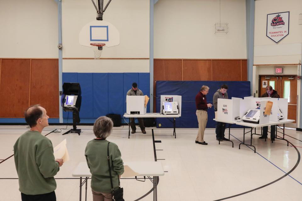 Voters cast ballots at an elementary school in Westerville, Ohio, on Nov. 5, 2019. During that election, dozens of Ohio voters whose registrations had been purged showed up and cast provisional ballots. A settlement in August between a voting-rights group and the Ohio Secretary of State made that possible.