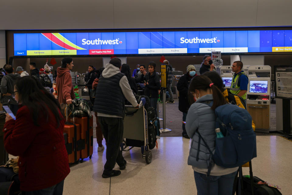 SAN FRANCISCO, CA - DECEMBER 26: Passengers lined up by the Southwest Airlines counter at San Francisco International Airport (SFO) in San Francisco, California, United States on December 26, 2022 as Southwest cancels more than  2,800 U.S. flights on Monday amid fierce winter storms. (Photo by Tayfun Coskun/Anadolu Agency via Getty Images)