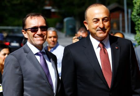 United Nations Special Advisor on Cyprus Espen Barth Eide welcomes Turkish Foreign Minister Mevlut Cavusoglu as he arrives for peace talks on divided Cyprus under the supervision of the United Nations in the alpine resort of Crans-Montana, Switzerland June 28, 2017. REUTERS/Denis Balibouse