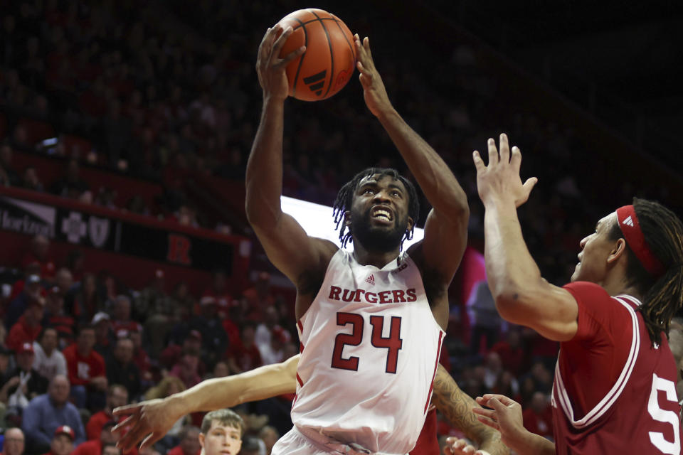 Rutgers guard Austin Williams (24) shoots the ball as Indiana forward Malik Reneau (5) defends during the second half of an NCAA college basketball game, Tuesday, Jan. 9, 2024 in Piscataway, N.J. (Andrew Mills/NJ Advance Media via AP)