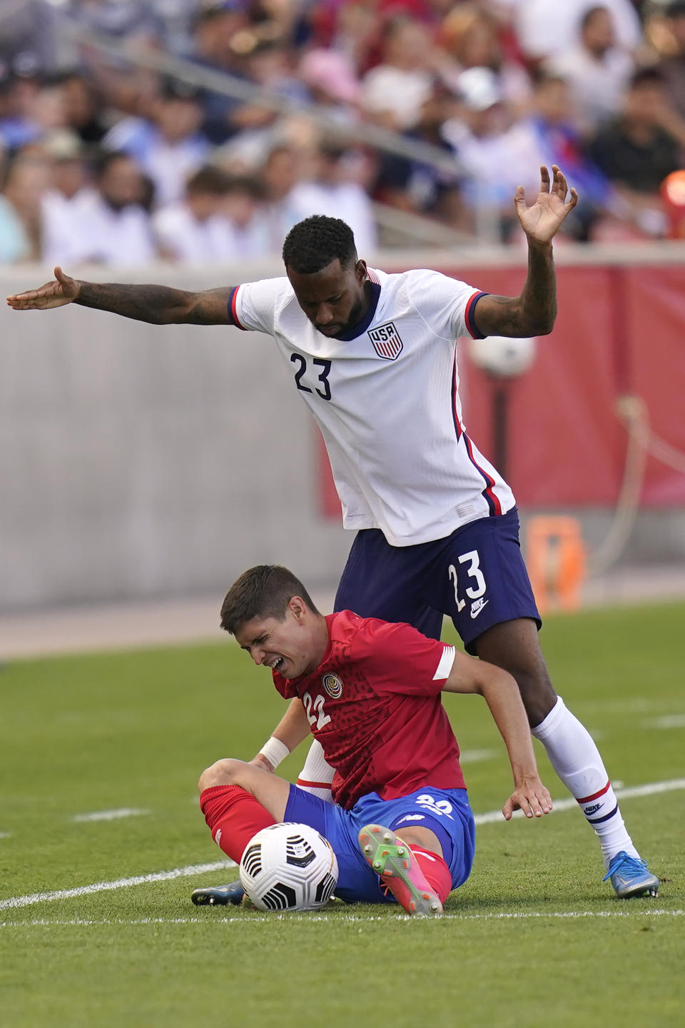 United States' Kellyn Acosta (23) defends against Costa Rica's Joseph Mora (22) during the second half of an international friendly soccer match Wednesday, June 9, 2021, in Sandy, Utah. (AP Photo/Rick Bowmer)