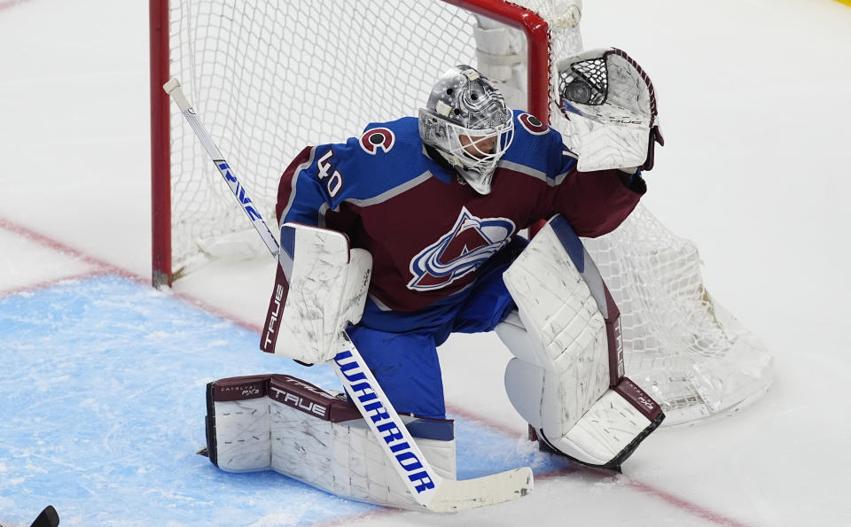 Colorado Avalanche goaltender Alexandar Georgiev makes a glove save against the Detroit Red Wings during the third period of an NHL hockey game Wednesday, March 6, 2024, in Denver. (AP Photo/David Zalubowski)