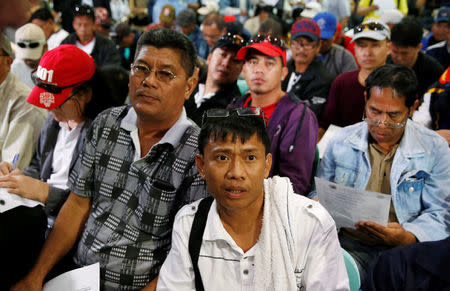 Filipino workers who were repatriated by the Philippine government from Saudi Arabia, wait for Philippine President Rodrigo Duterte after arriving at the Ninoy Aquino International Airport in Manila, Philippines August 31, 2016. REUTERS/Erik De Castro