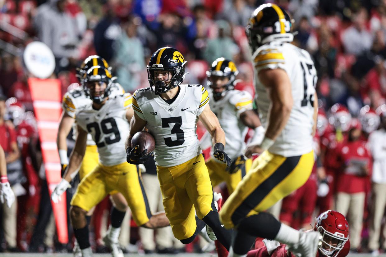 Sep 24, 2022; Piscataway, New Jersey, USA; Iowa Hawkeyes defensive back Cooper DeJean (3) returns an interception for a touchdown during the first half against the Rutgers Scarlet Knights at SHI Stadium. Mandatory Credit: Vincent Carchietta-USA TODAY Sports