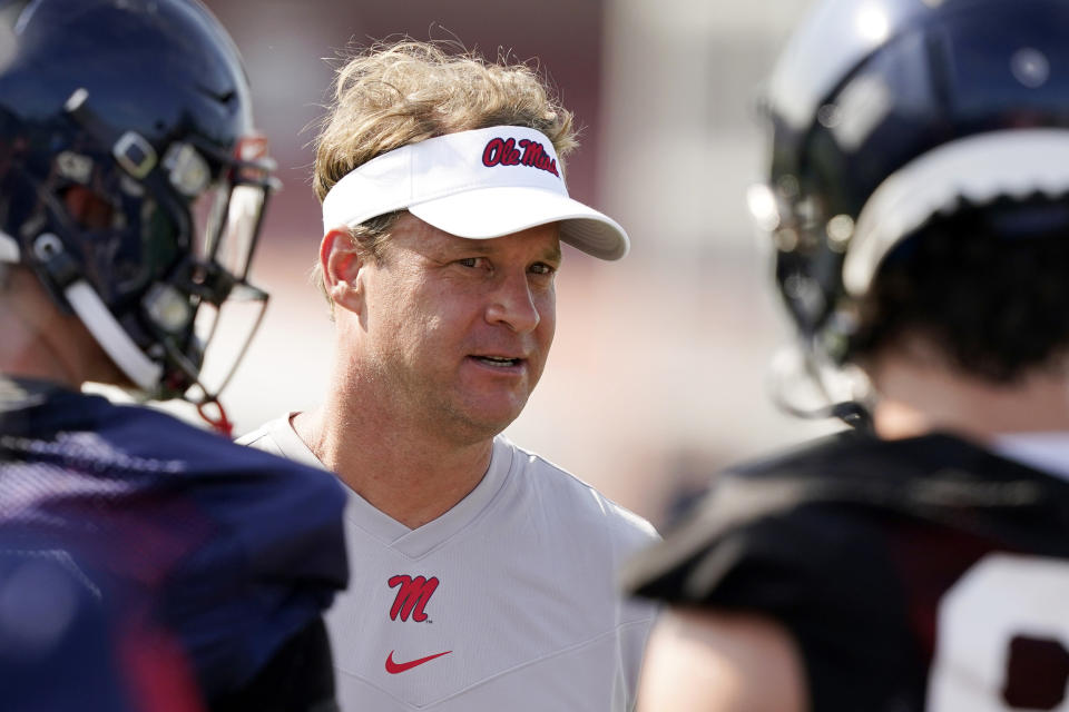 Mississippi coach Lane Kiffin will miss Monday's game against Louisville. (AP Photo/Rogelio V. Solis, File)