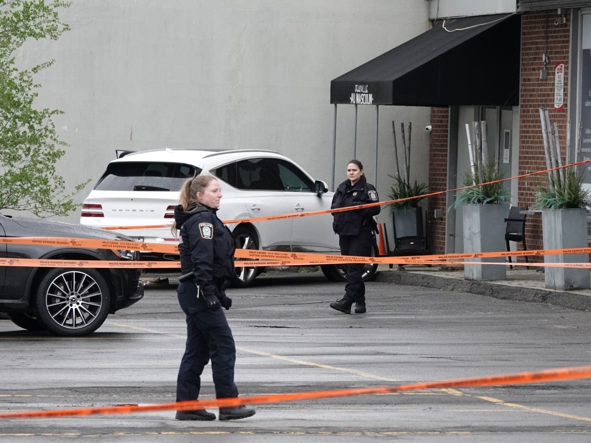 Montreal police say the woman's car collided with a building after she was fatally shot. The victim was declared dead on the scene. (Kolya H. Guilbault/Radio-Canada - image credit)