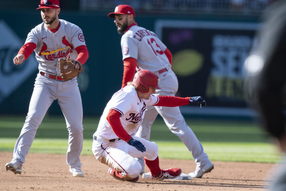 Washington Nationals Andrew Stevenson (17) is out at second as St. Louis Cardinals shortstop Paul DeJong, left, throws to first to complete a double play during the third inning of a baseball game in Washington, Wednesday, April 21, 2021. (AP Photo/Manuel Balce Ceneta)