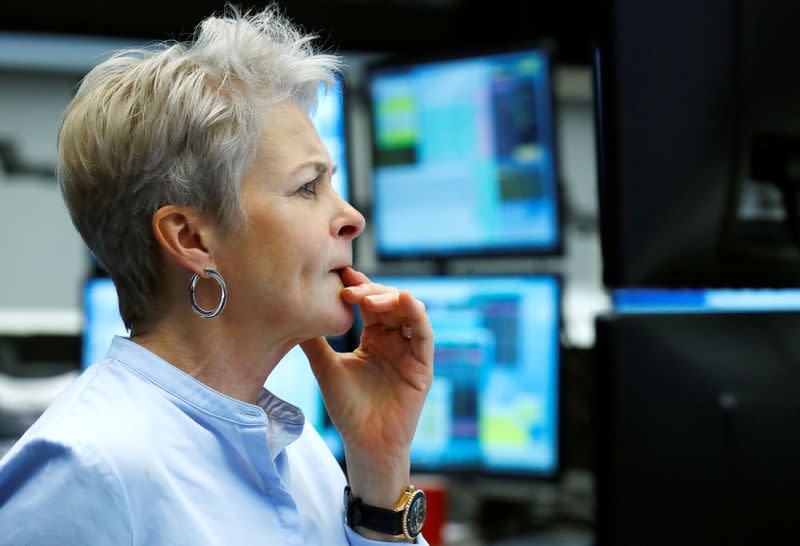 A trader works at Frankfurt's stock exchange in Frankfurt