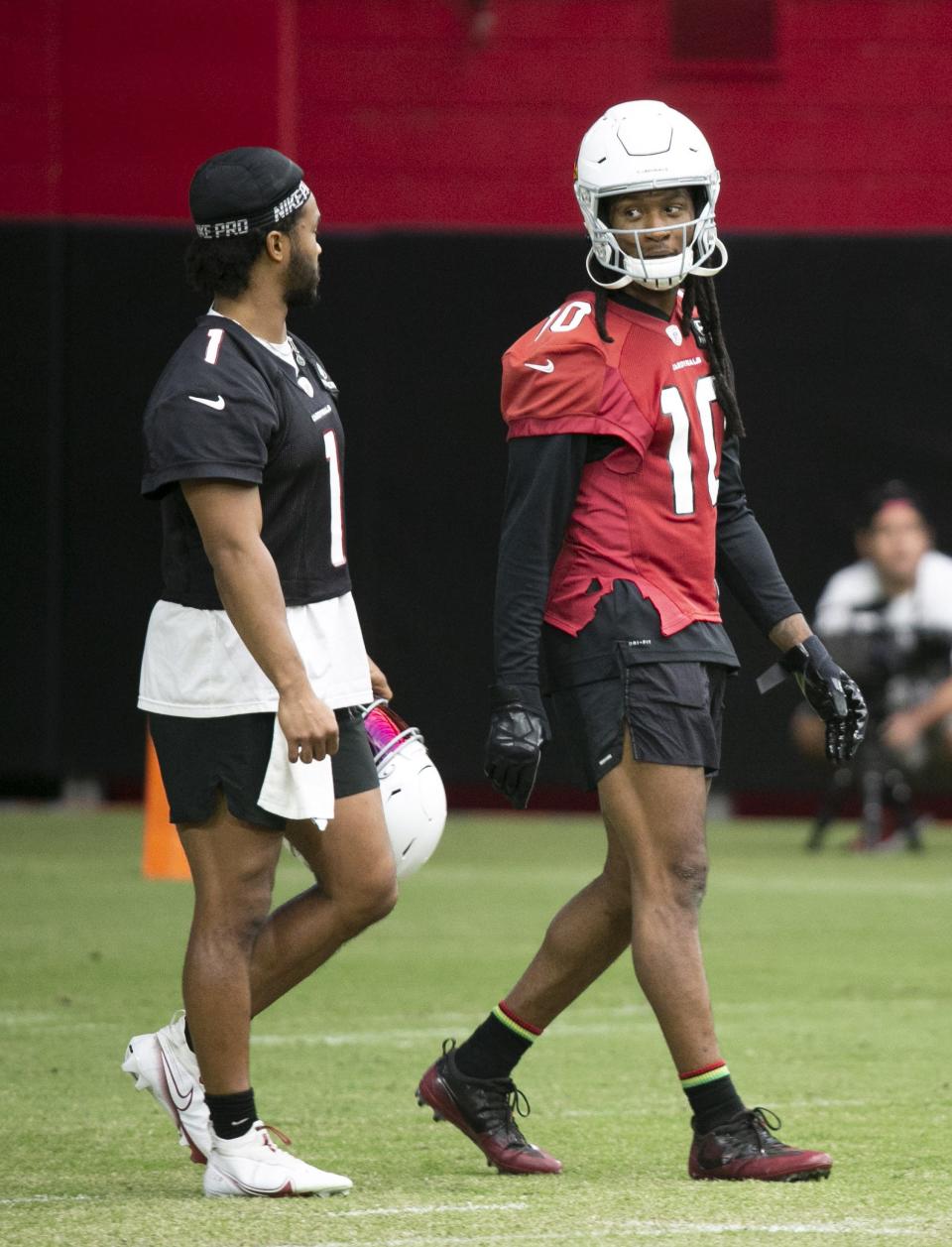 Cardinals quarterback Kyler Murray, left, and wide receiver DeAndre Hopkins, converse during a practice at State Farm Stadium in Glendale on August 26, 2021.