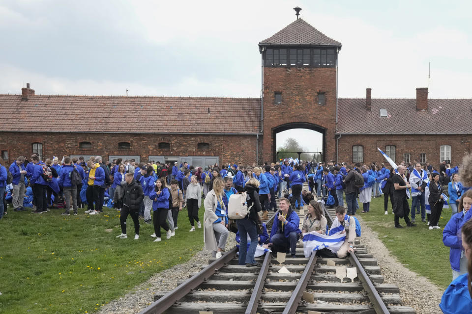 Jewish people visit the Auschwitz Nazi concentration camp after the March of the Living annual observance that was not held for two years due to the global COVID-19 pandemic, in Oswiecim, Poland, Thursday, April 28, 2022. Only eight survivors and some 2,500 young Jews and non-Jews are taking part in the annual march that is scaled down this year because of the war in neighboring Ukraine that is fighting Russia's invasion. (AP Photo/Czarek Sokolowski)