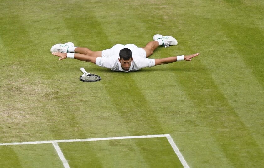 Serbia's Novak Djokovic reacts after making a passing shot to Italy's Jannik Sinner