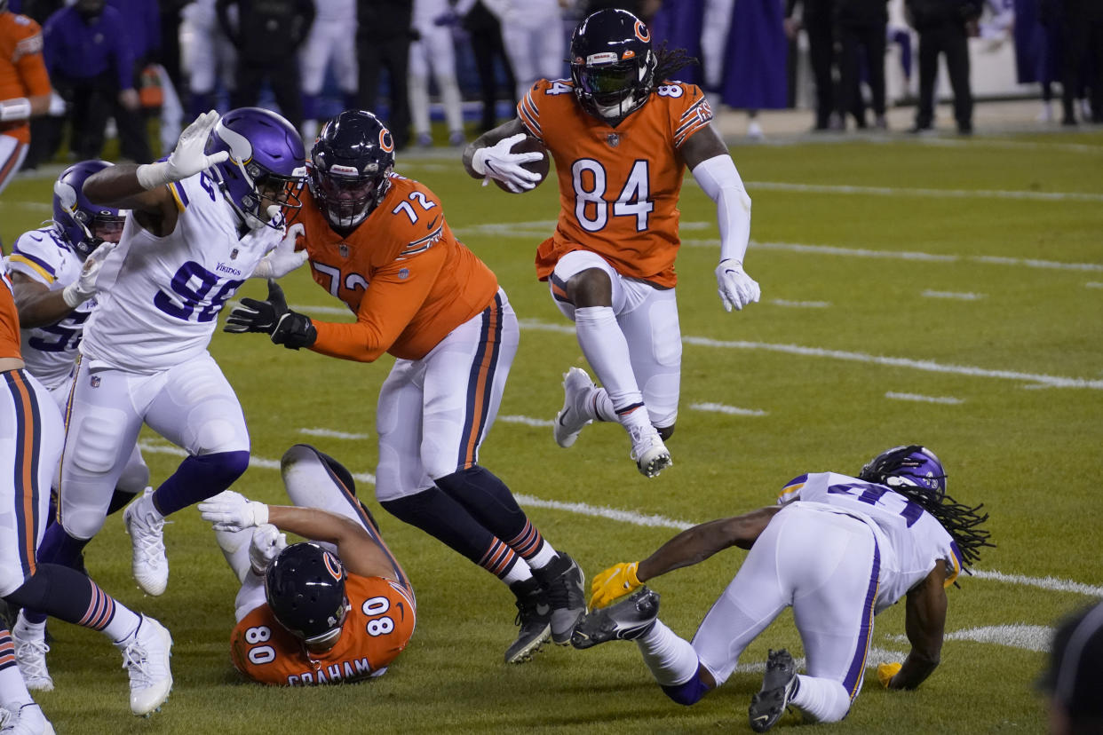 Cordarrelle Patterson, in his role as a running back, leaps over a Vikings defender. (AP Photo/Nam Y. Huh)