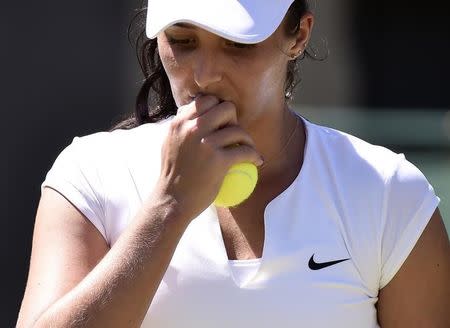 Laura Robson of Britain reacts during her match against Evgeniya Rodina of Russia at the Wimbledon Tennis Championships in London, June 30, 2015. REUTERS/Toby Melville