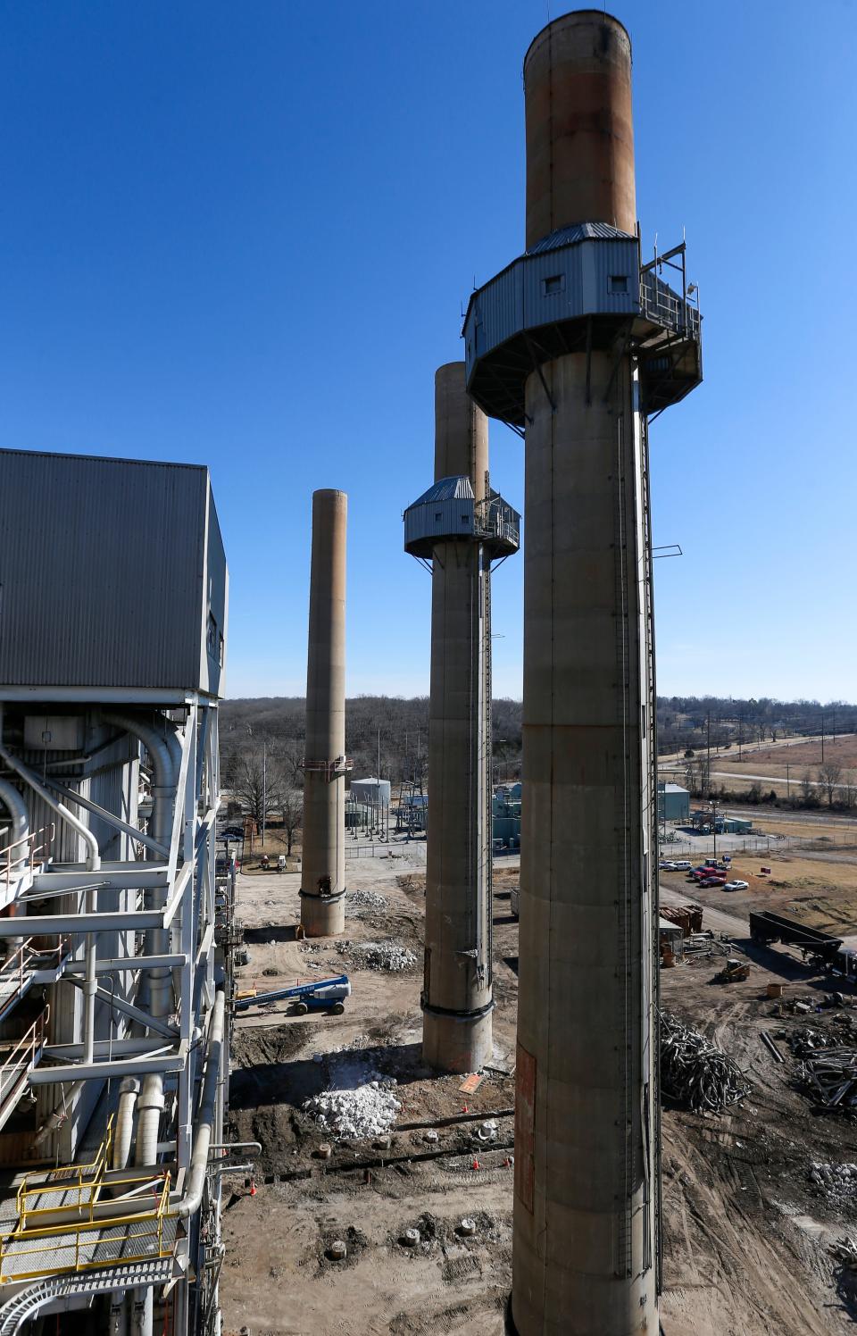 Construction crews demolish equipment at the James River Power Station on Monday, Jan. 31, 2022. The smokestacks at the decommissioned power plant are set to be imploded later this month. 